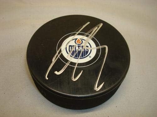 Justin Schultz Aláírt Edmonton Oilers Jégkorong Dedikált PSA/DNS-COA-1B - Dedikált NHL Korong